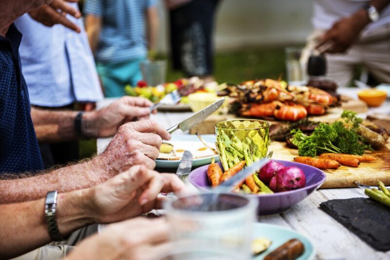 Closeup Of Diverse People Enjoying Barbecue Party Together E1626173441206